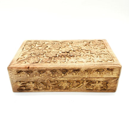hand carved flowers on large wooden box
