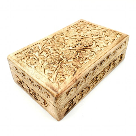 large hand carved flowers on wood box