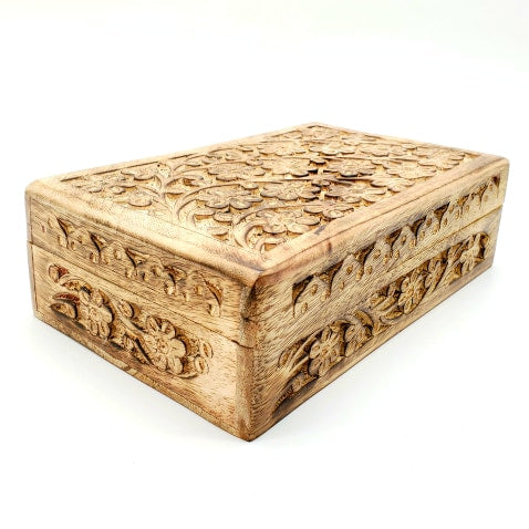 large hand carved flowers on wooden box
